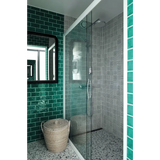 Happy Homes round woven wicker laundry basket on speckled floor