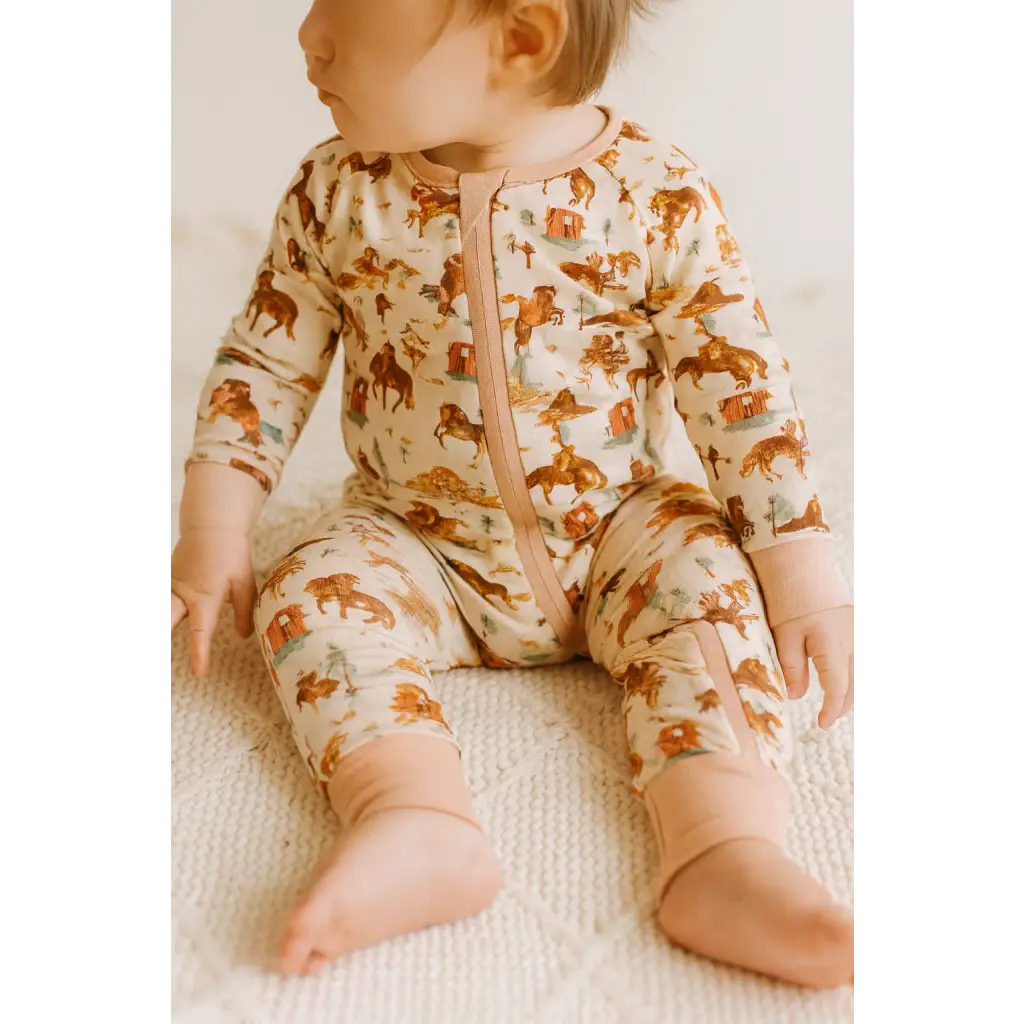 Cute bamboo baby sleeper with Western print and front zipper for comfy naps