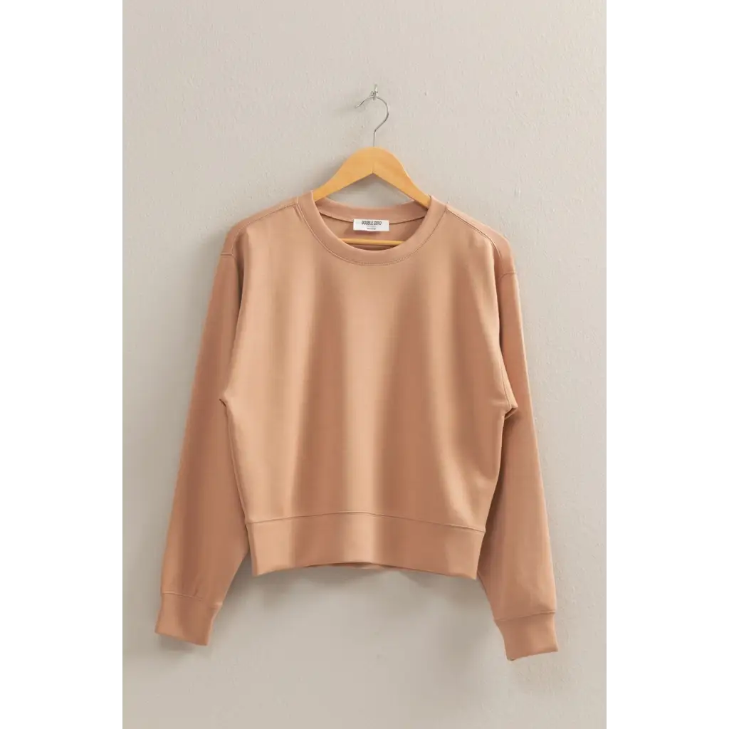 Beige crewneck sweatshirt on hanger, perfect stylish womens clothes for moms