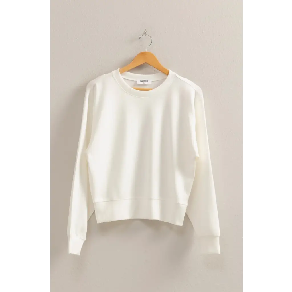 White cotton crewneck sweatshirt on wooden hanger, perfect stylish womens clothes