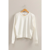 White cotton crewneck sweatshirt on wooden hanger, perfect stylish womens clothes