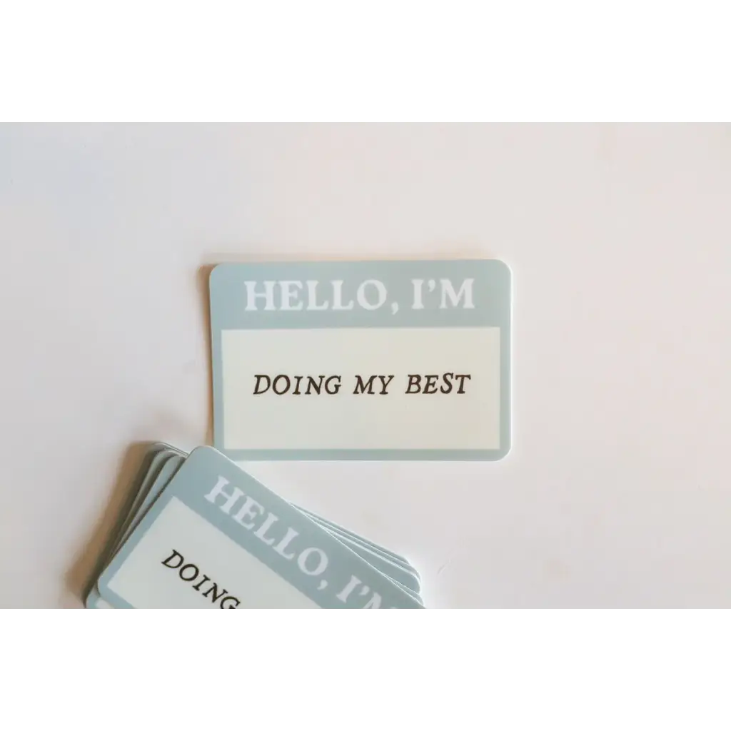 Name tag sticker saying HELLO, I’M DOING MY BEST inspired by favorite tee quotes