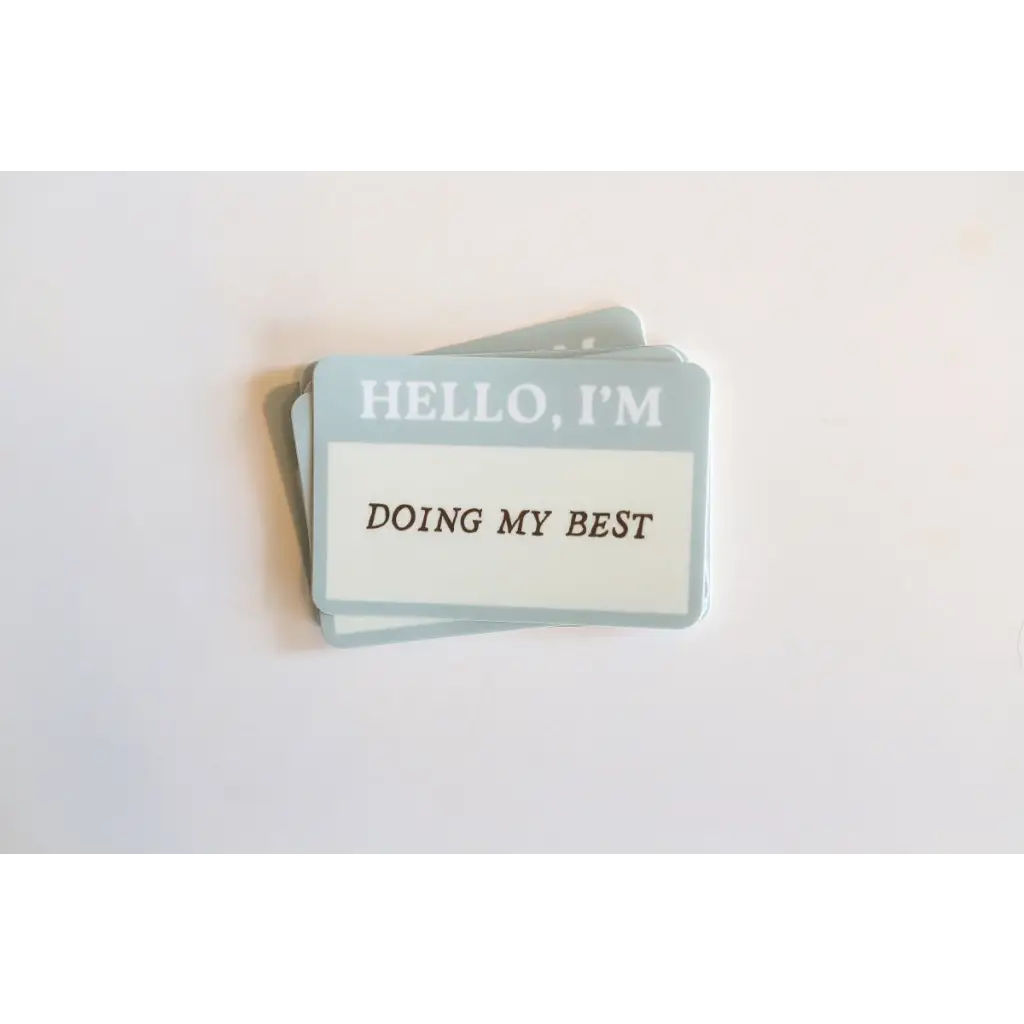 Name tag sticker saying HELLO, I’M DOING MY BEST inspired by favorite tee quotes