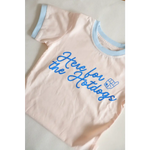 Pink Here for the Holidays Brutally Honest Tee in Organic Cotton with blue trim