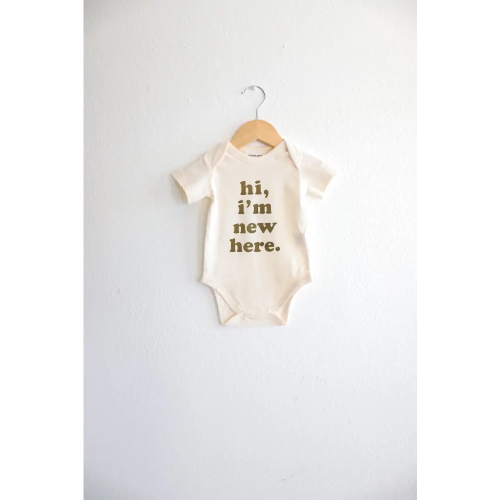 Baby onesie with hi, I’m new here text in green, perfect for 3mo fits closer arrivals