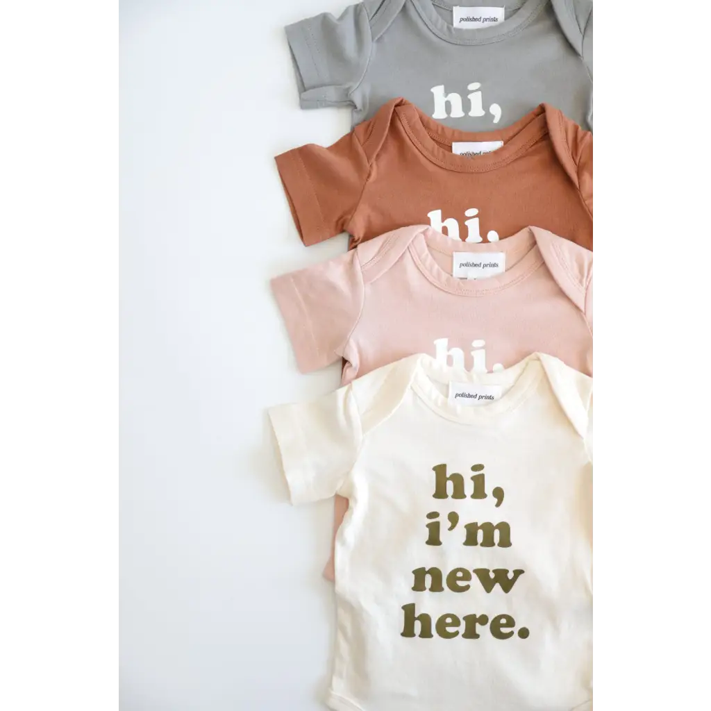 Four neutral baby onesies saying hi, perfect for 3mo fits closer and new arrivals