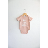 Cute pink baby onesie made from organic cotton featuring polished prints for stylish looks