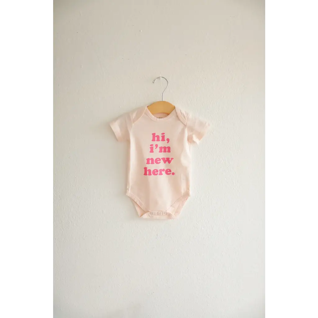 Cute Pink and White Organic Cotton Baby Onesie with Hi, I’m New Here Text