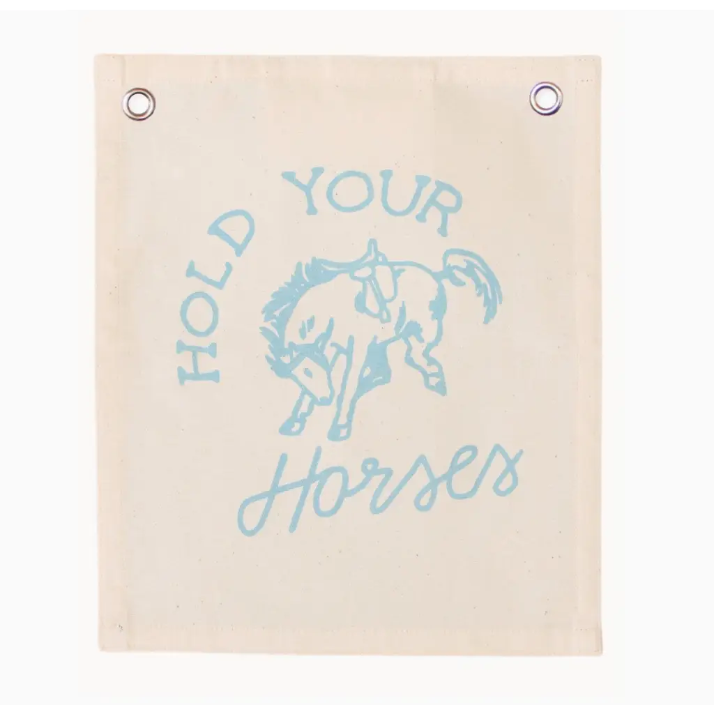 Light blue canvas banner featuring a bucking bronco design and text HOLD YOUR HORSES