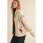 Cream-colored horse knit sweater cardigan with black zigzags and pixelated horse motif