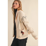 Cream-colored horse knit sweater cardigan with black zigzags and pixelated horse motif