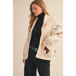 Cream-colored Holly Horse Knit Sweater Cardigan with black geometric pattern and red horse motif