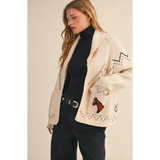 Cream-colored Holly Horse Knit Sweater Cardigan with black geometric pattern and red horse motif