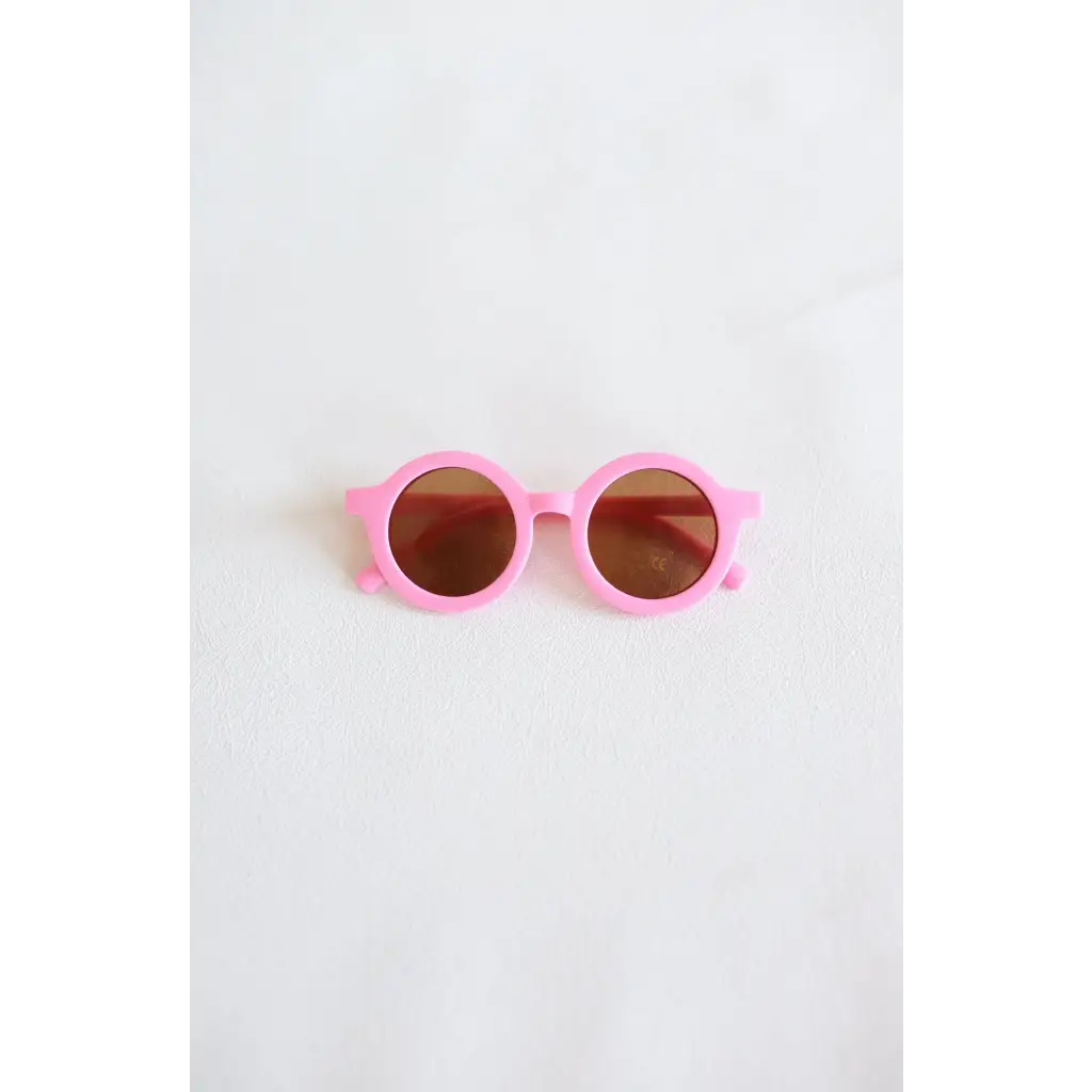 Pink round sunglasses with brown lenses for a super cool retro-inspired vibe