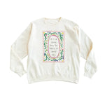 Cream-colored long-sleeved sweatshirt with good day script in polished prints