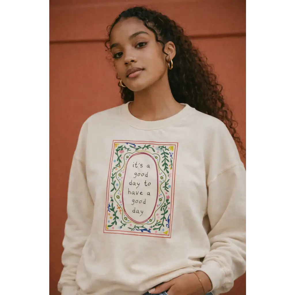 Cream-colored oversized sweatshirt with good day embroidered floral design