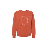 Rust-colored Independent Trading Company pullover with embroidered quote