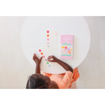 Child with Ice Cream Pocket Watercolor Book enjoying colorful sticker activity, perfect for stylish womens clothes fans