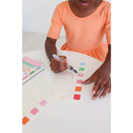 Kid in orange dress colors ice cream watercolor book swatches