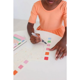 Kid in orange dress colors ice cream watercolor book swatches