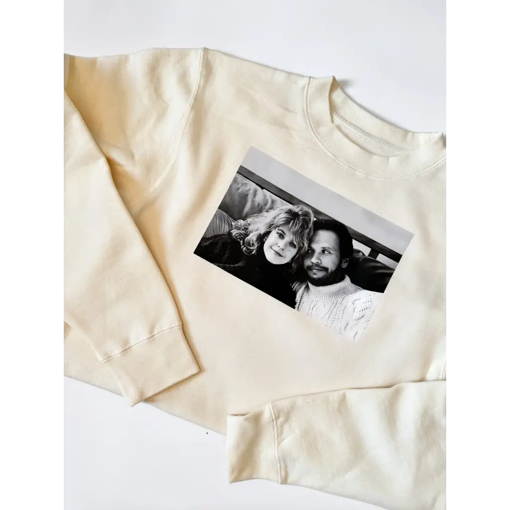 Cream-colored Sally pullover featuring a classic Harry Met Sally photo on top