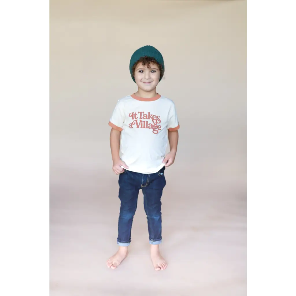 Child in It Takes a Village Ringer Tee for Kids, stylish and comfy with polished prints