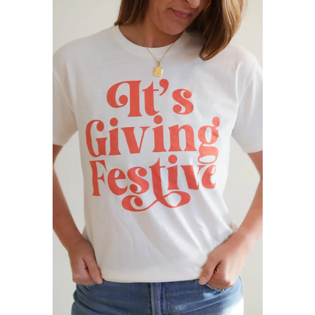 White Giving Festive Unisex T-shirt with coral text for a fun, stylish look