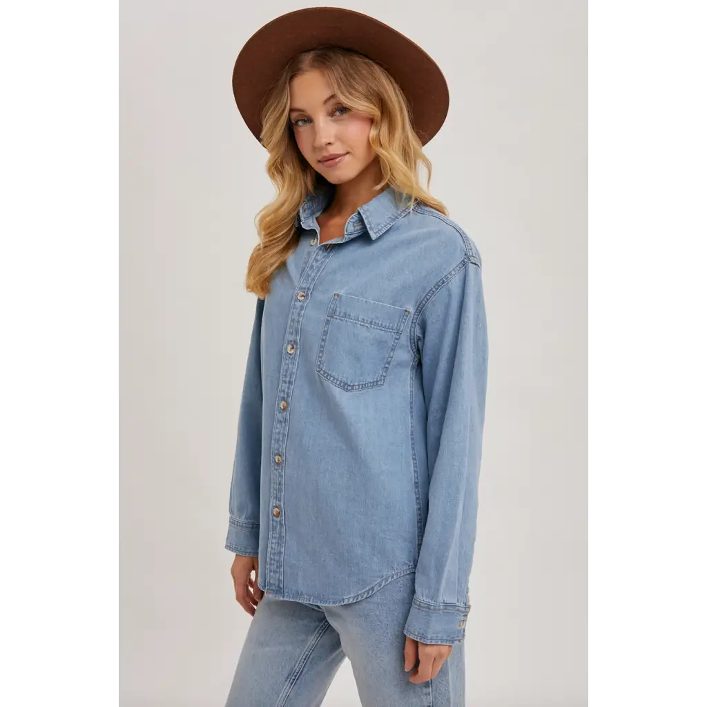 Light blue denim button-up shirt with chest pocket, perfect for stylish moms