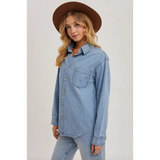 Light blue denim button-up shirt with chest pocket, perfect for stylish moms