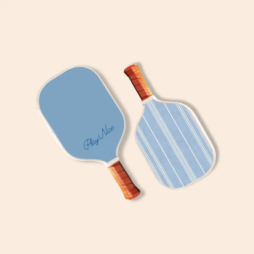 Two blue pickleball paddles with wooden handles perfect for mini pickle ball fun