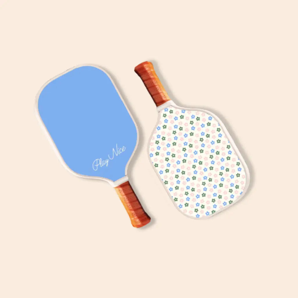 Two bright kids pickle ball paddles, one blue and one with a fun polka dot pattern