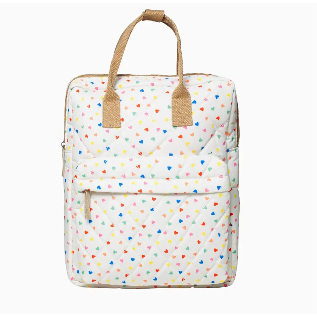 White quilted rucksack with rainbow hearts and tan leather straps for a fun vibe