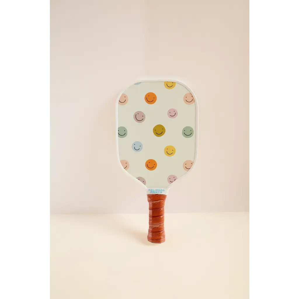 Polka-dotted mini pickle ball paddle with brown leather grip for little players to start em’ young