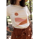 Golden Relaxed Graphic Tee featuring minimalist pink desert landscape and sun design