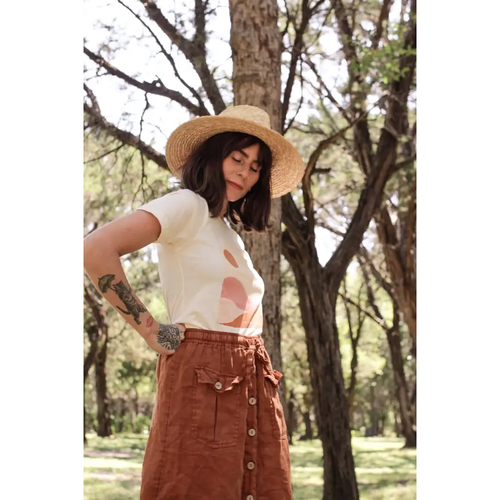 Brown corduroy button-front skirt with utility pockets paired with Golden Relaxed Graphic Tee