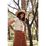 Brown corduroy button-front skirt with utility pockets paired with Golden Relaxed Graphic Tee