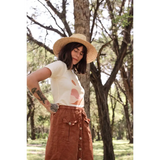 Brown corduroy button-front skirt with utility pockets paired with Golden Relaxed Graphic Tee