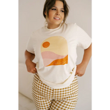 Golden Relaxed Graphic Tee with minimalist sunset design in orange and pink tones