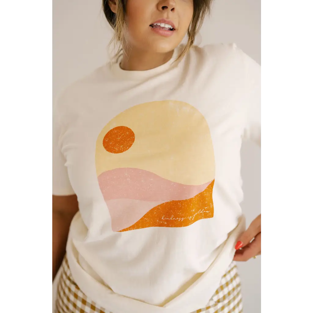 Golden Relaxed Graphic Tee with minimalist desert sunset in peach, orange, and yellow tones