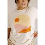 Golden Relaxed Graphic Tee with minimalist desert sunset in peach, orange, and yellow tones