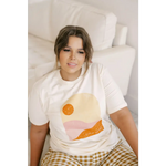 Golden Relaxed Graphic Tee with a cool abstract sunset design in orange and pink