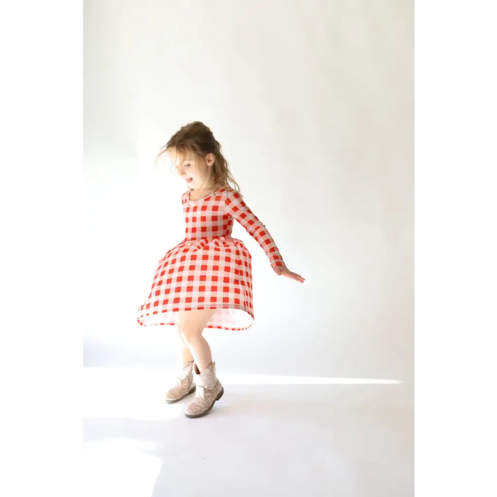 Adorable Kit Plaid Dress for Girls in red and white gingham with long sleeves perfect for twirling