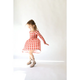 Adorable Kit Plaid Dress for Girls in red and white gingham with long sleeves perfect for twirling