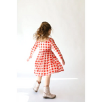 Red and white gingham Kit Plaid Dress for Girls featuring long sleeved twirl skirt