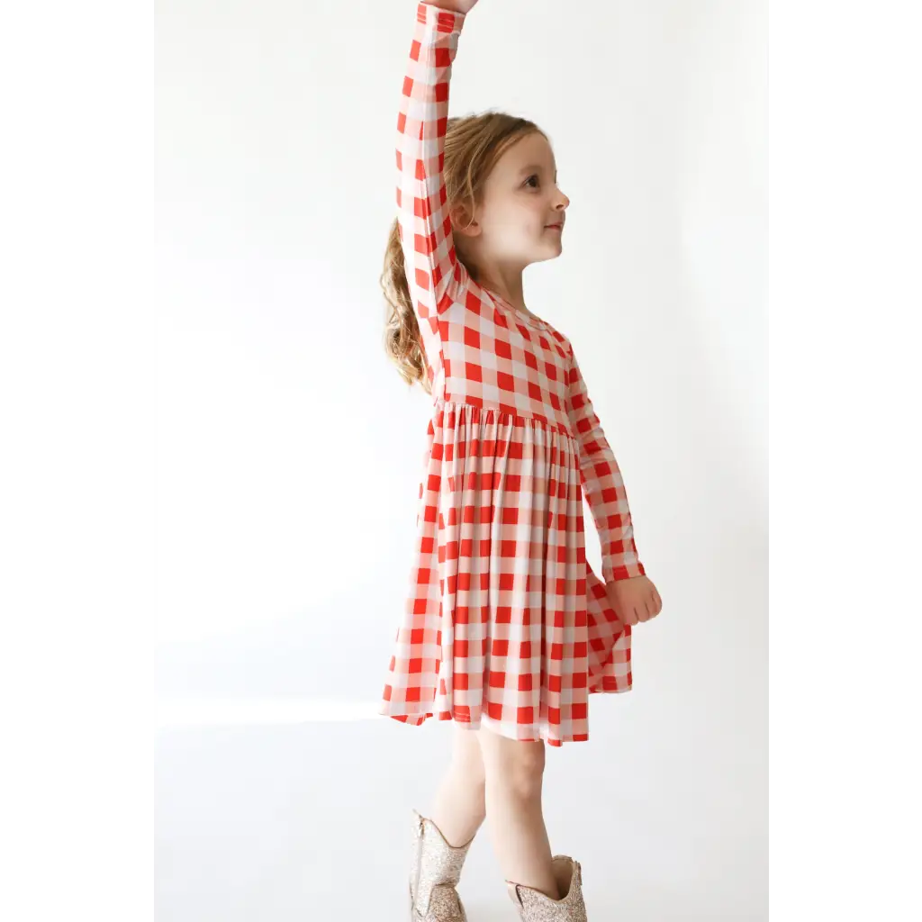 Red and white checkered Kit Plaid Dress for Girls with long sleeves and a gathered waist