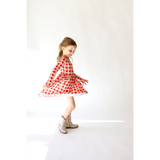 Red and white checkered Kit Plaid Dress for Girls with a twirling skirt and long sleeves