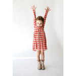 Red and white checkered Kit Plaid Dress for girls with stylish boots, perfect for twirling