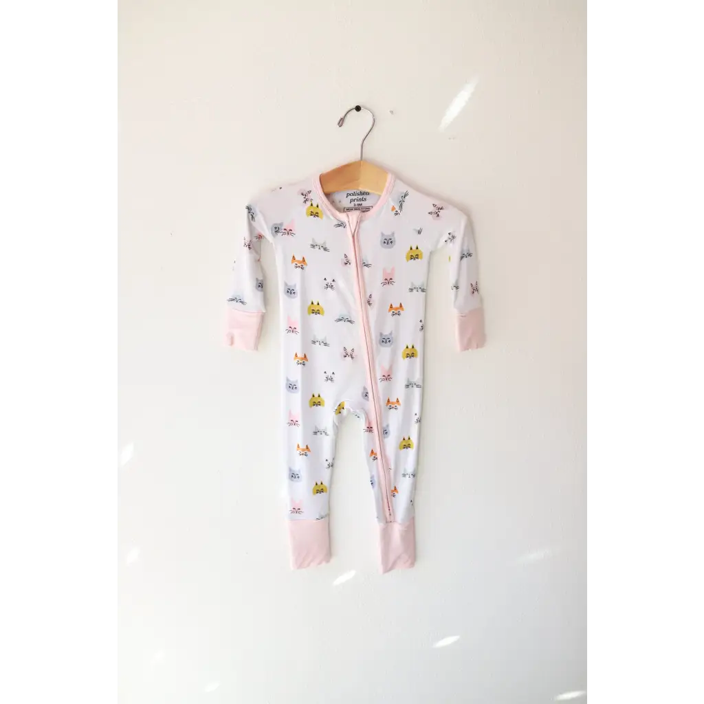 White baby onesie with animal print from the Kitty Cat Bamboo Baby Sleeper collection