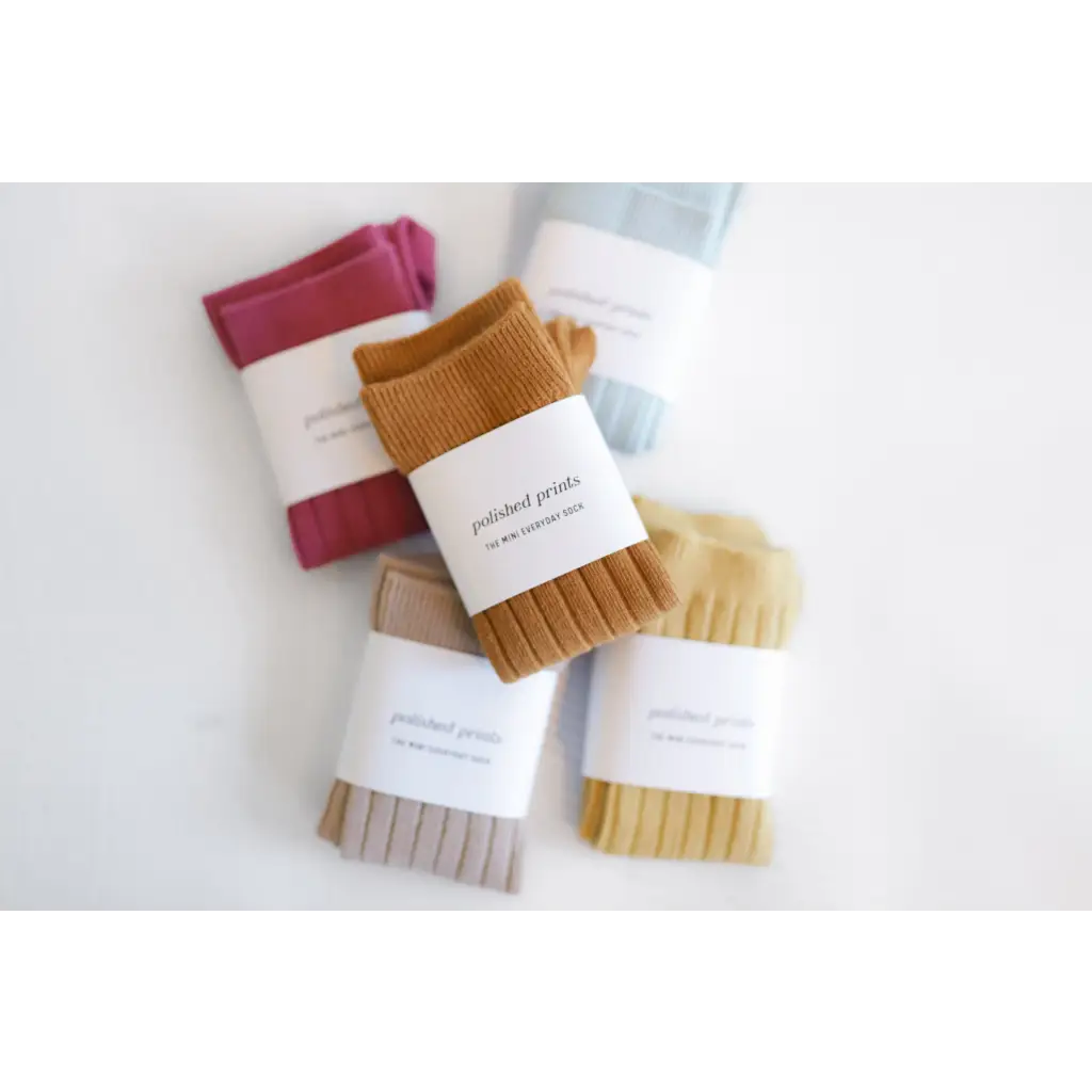 Colorful ribbed knee high socks wrapped in labels, perfect for cute babies and kids