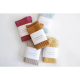 Colorful ribbed knee high socks wrapped in labels, perfect for cute babies and kids